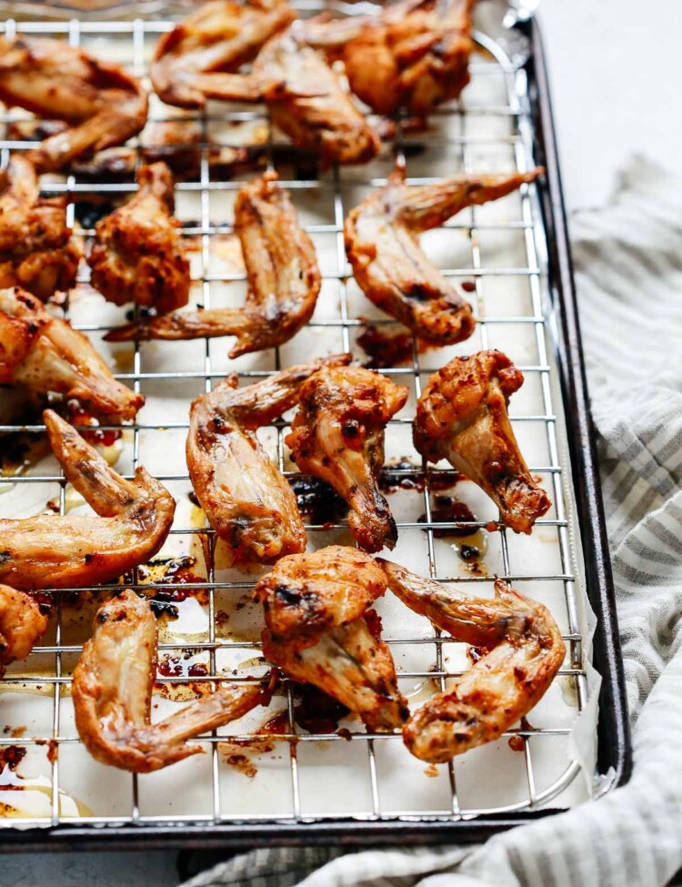 overhead view of crispy baked chicken wings on a rack