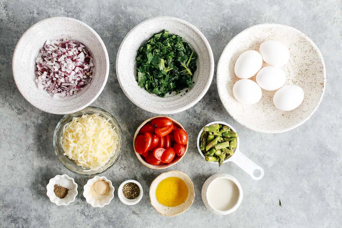 ingredients in bowls to make a baked eggs recipe