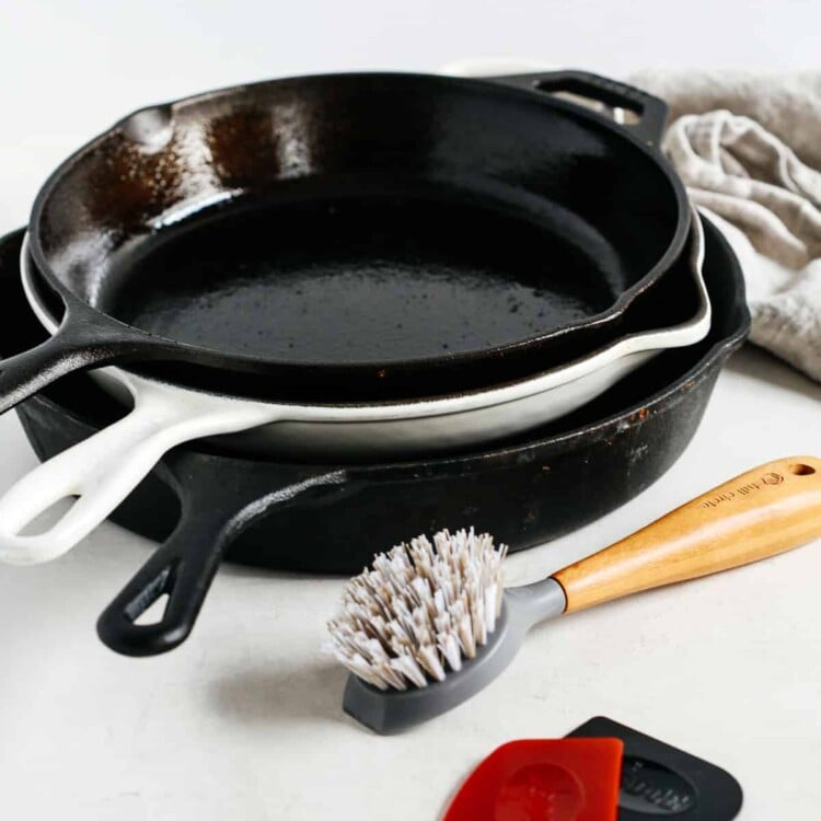 3 cast iron skillets in a countertop