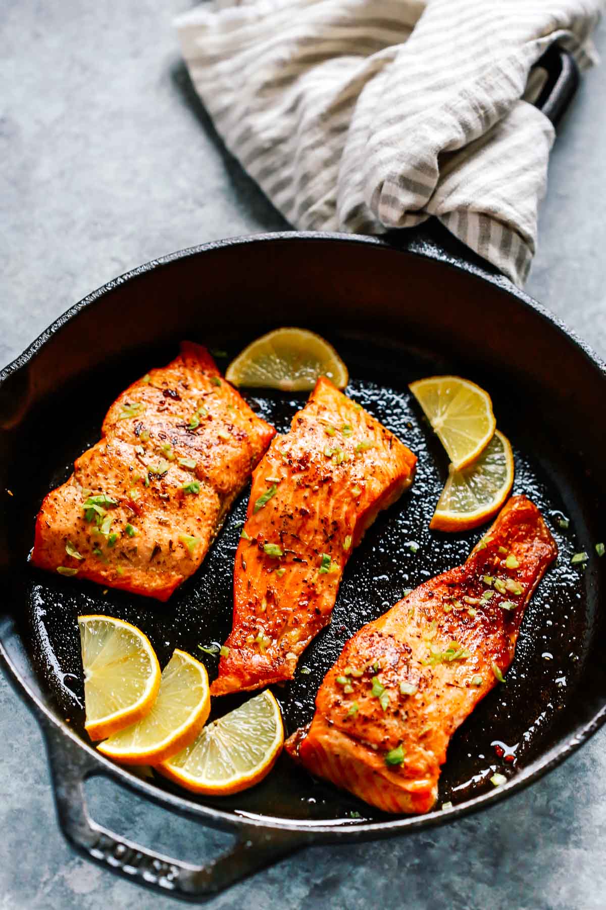 A bowl of food, with Blackened salmon
