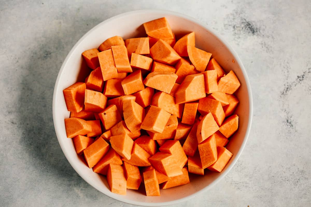 bowl of raw chopped sweet potato