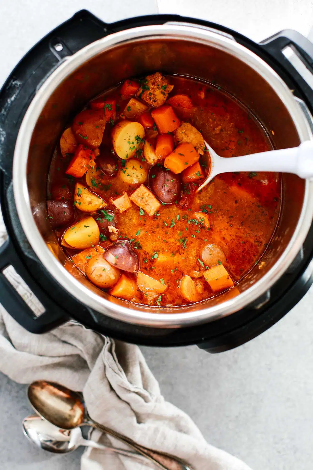 chicken vegetable stew cooking in a pressure cooker