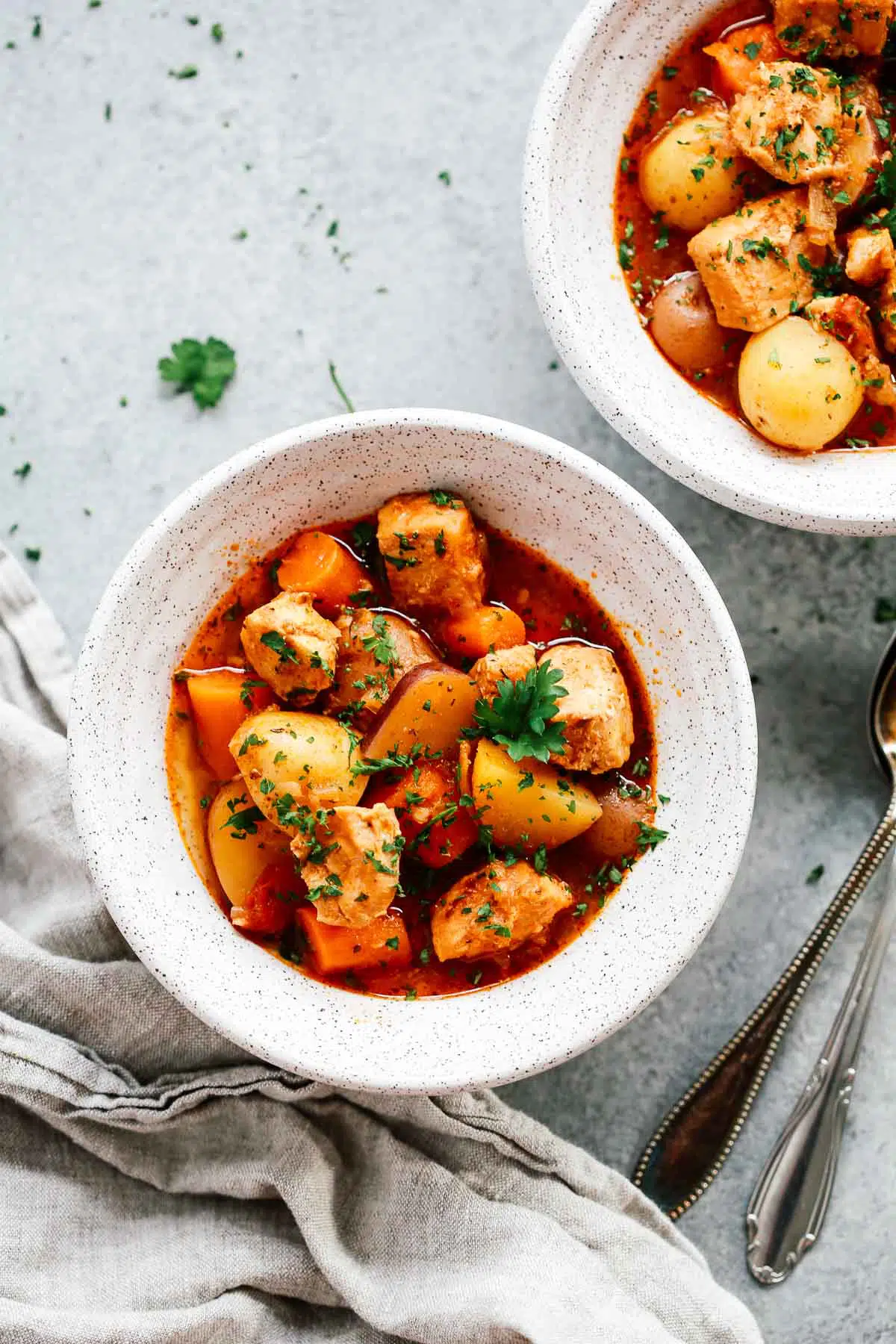 overhead view of two bowls of Instant Pot chicken stew - gluten-free dinner recipes