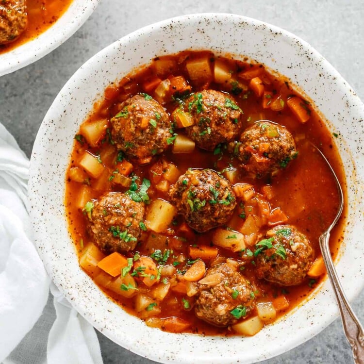 overhead view of a white bowl containing Meatball soup