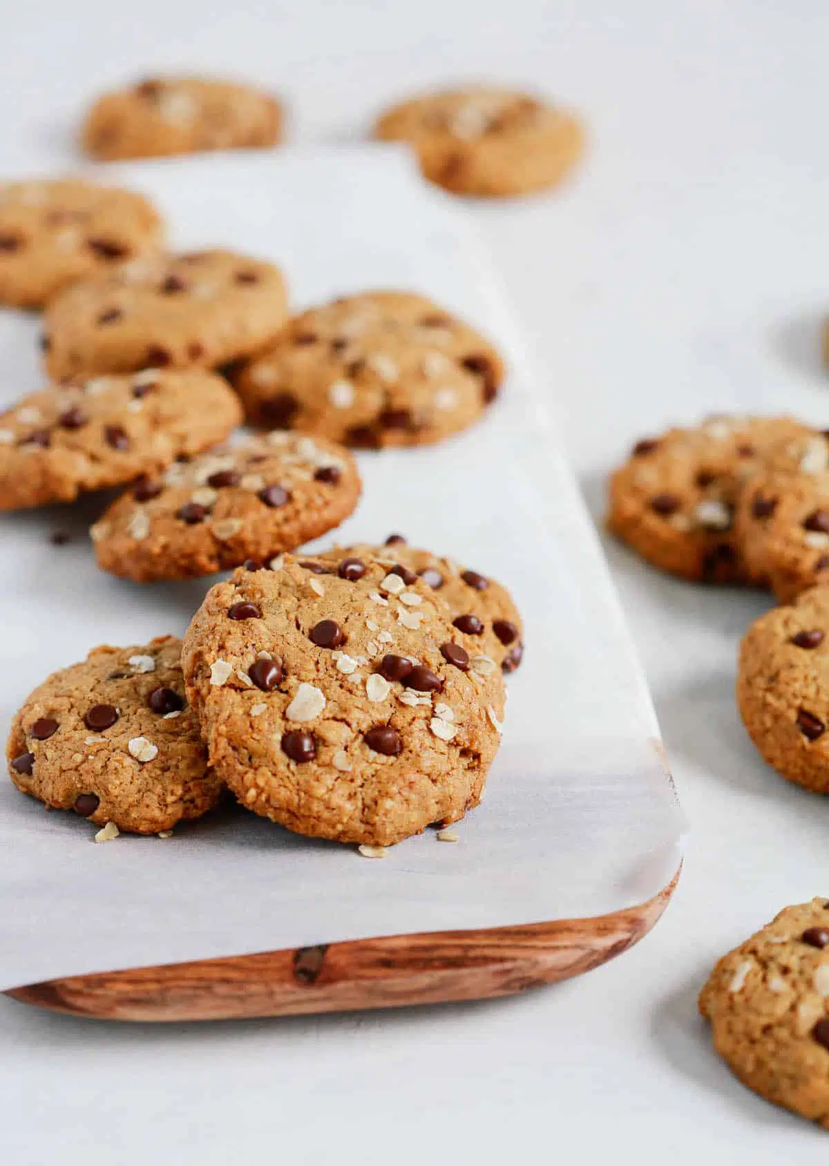 Chocolate chip cookies spread over a countertop