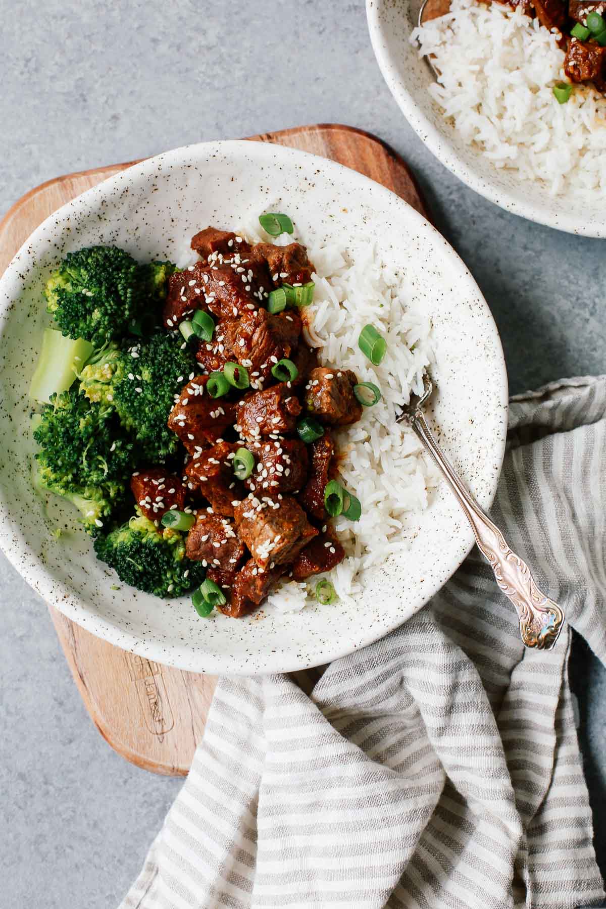Korean beef dinner with steamed white rice and broccoli