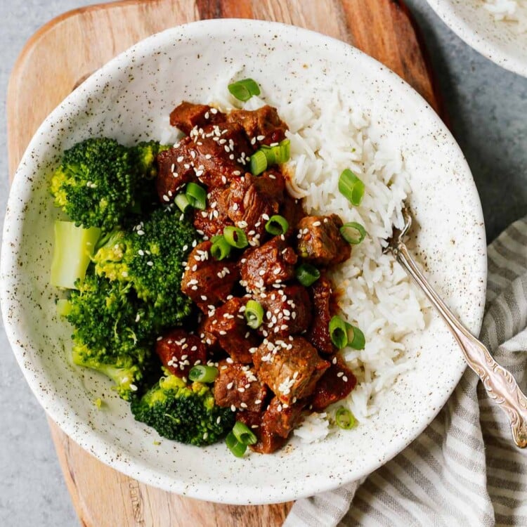 white place with Instant Pot Korean beef served over white rice with broccoli