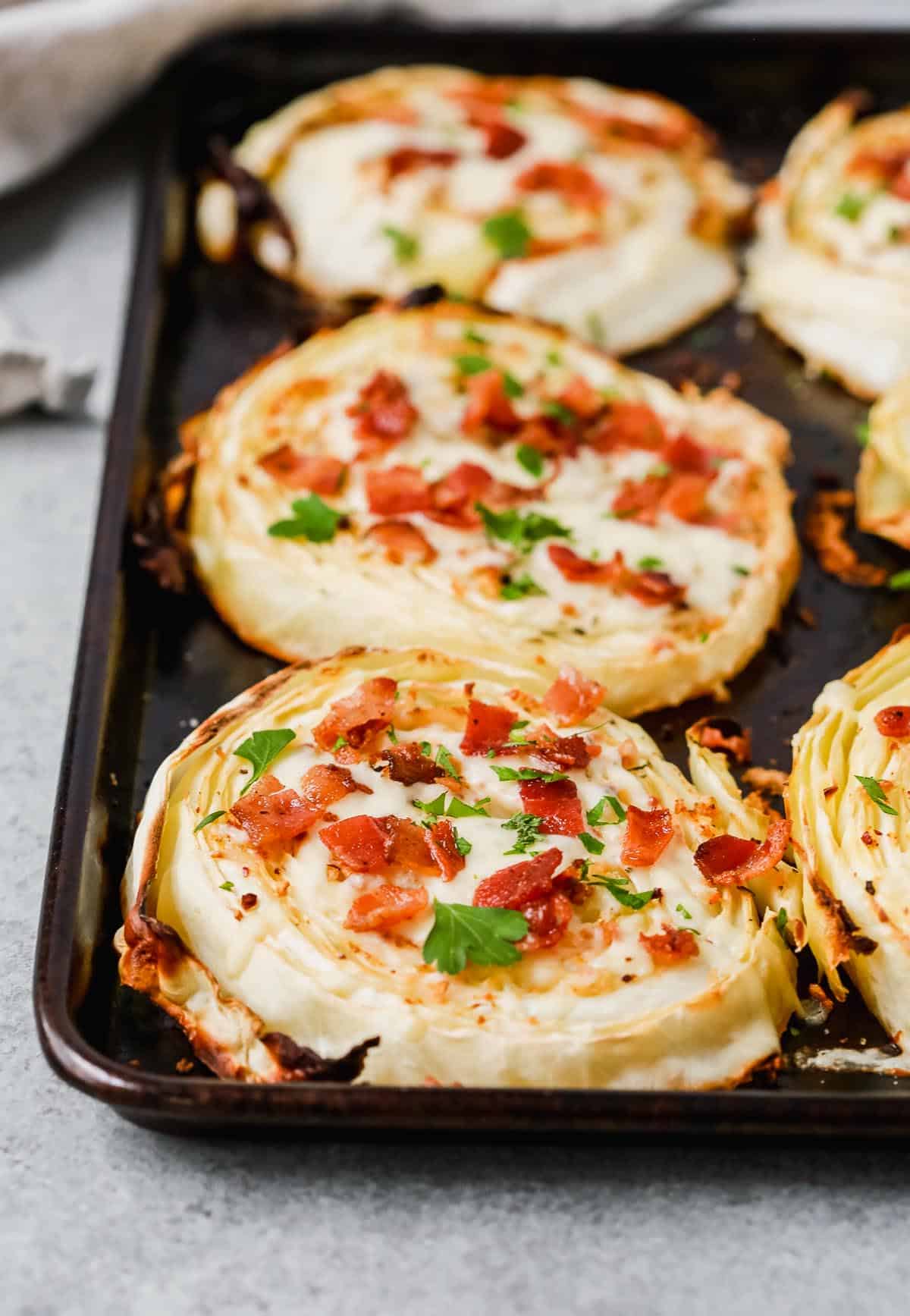 slices of roasted cabbage steak with toppings