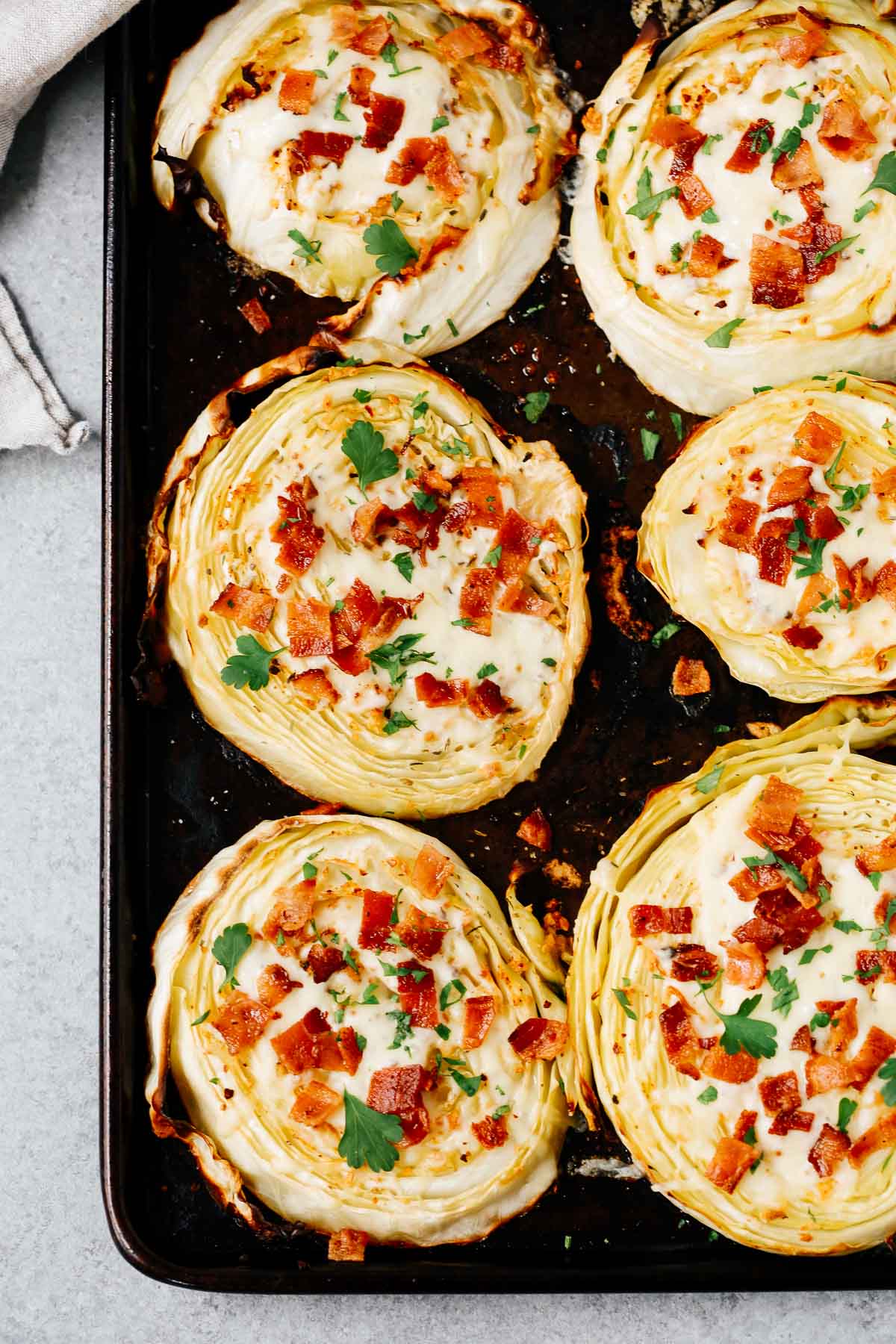 Overhead image of six cabbage steaks.