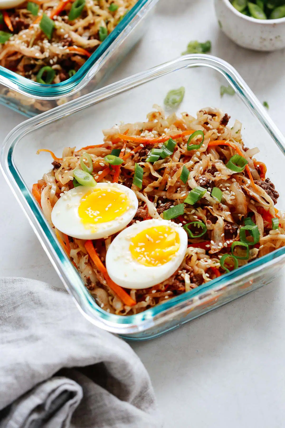 egg roll in a bowl with egg halves divided into containers