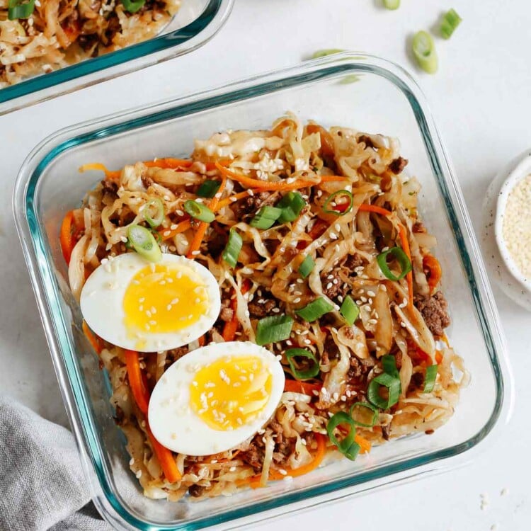 overhead view of an egg roll in a bowl recipe in a glass container