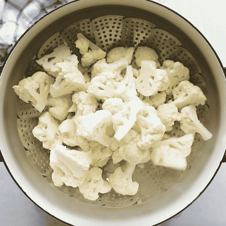 overhead view of a large pot containing cauliflower