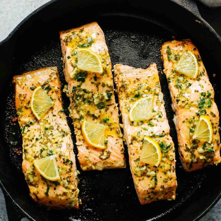 baked salmon with lemon in a cast iron skillet