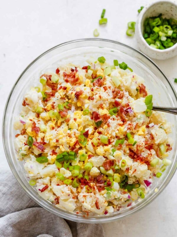 overhead view of a glass bowl containing potato salad
