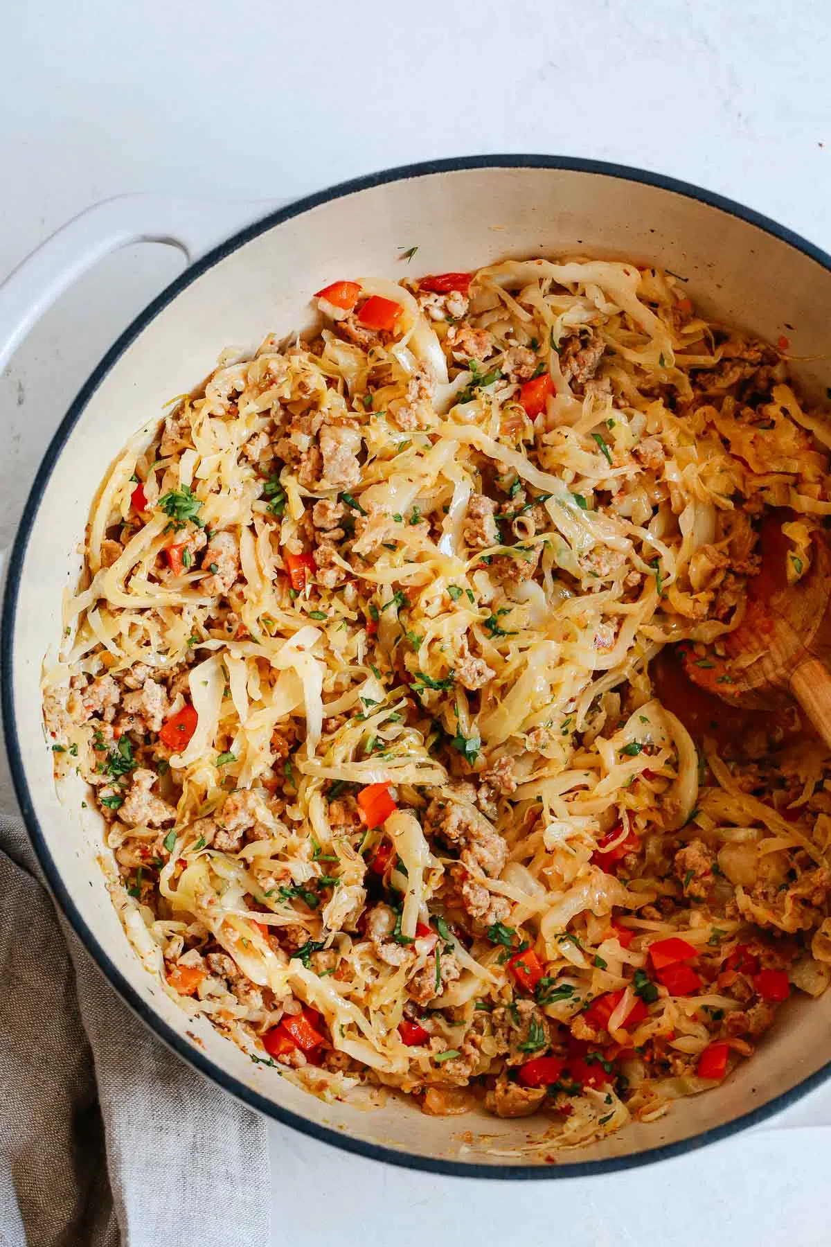 Overhead photo of one pan cabbage and sausage.