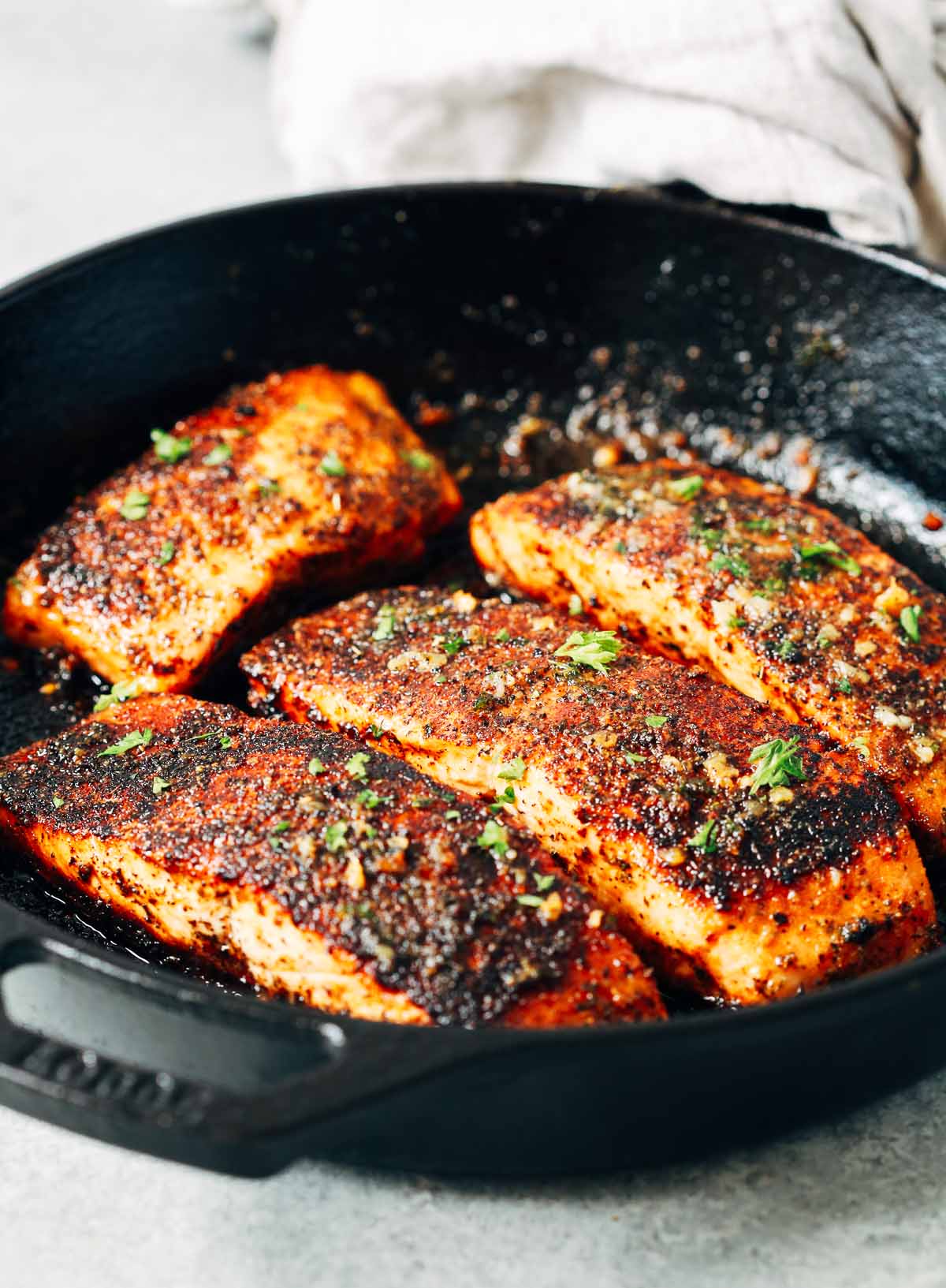 close up of Blackened salmon in a cast iron skillet - gluten-free dinner recipes