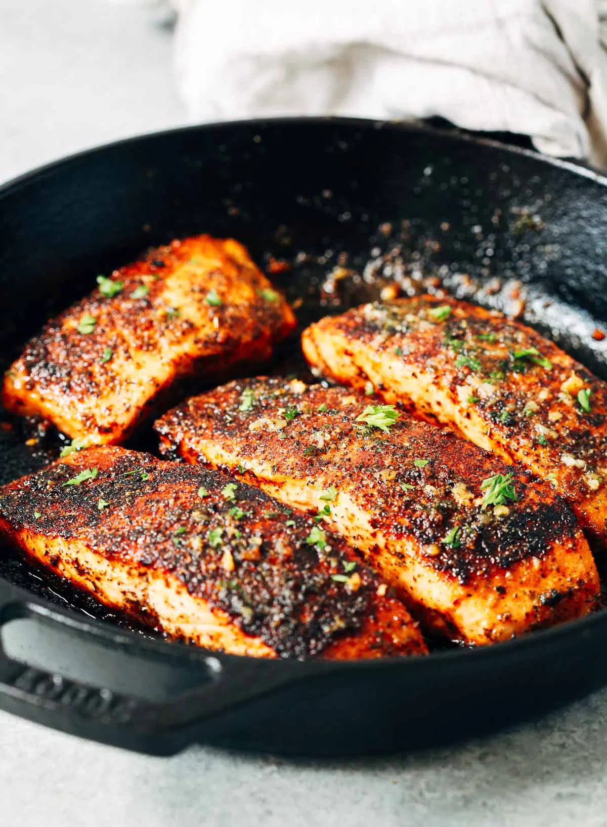 close up of Blackened salmon in a cast iron skillet