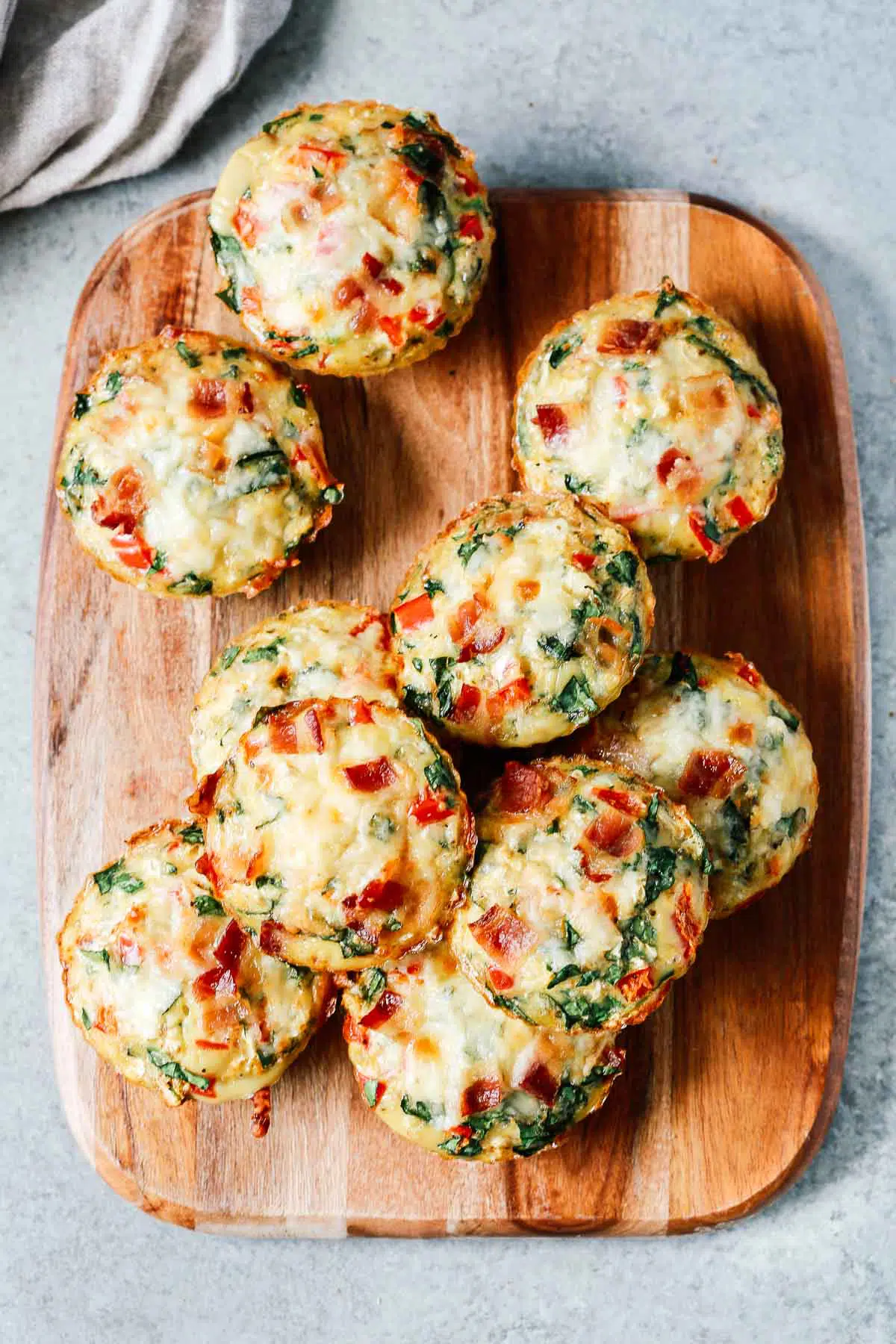 Overhead photo of a serving board with egg muffins on it.