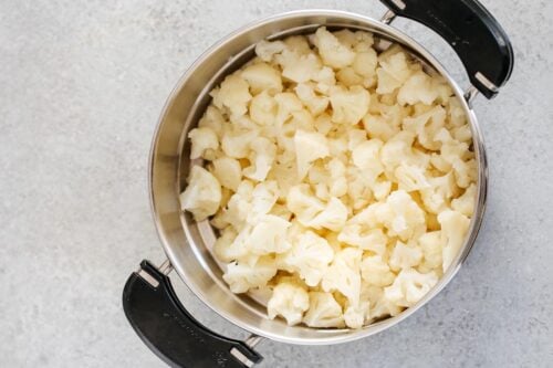cauliflower florets in a steam basket