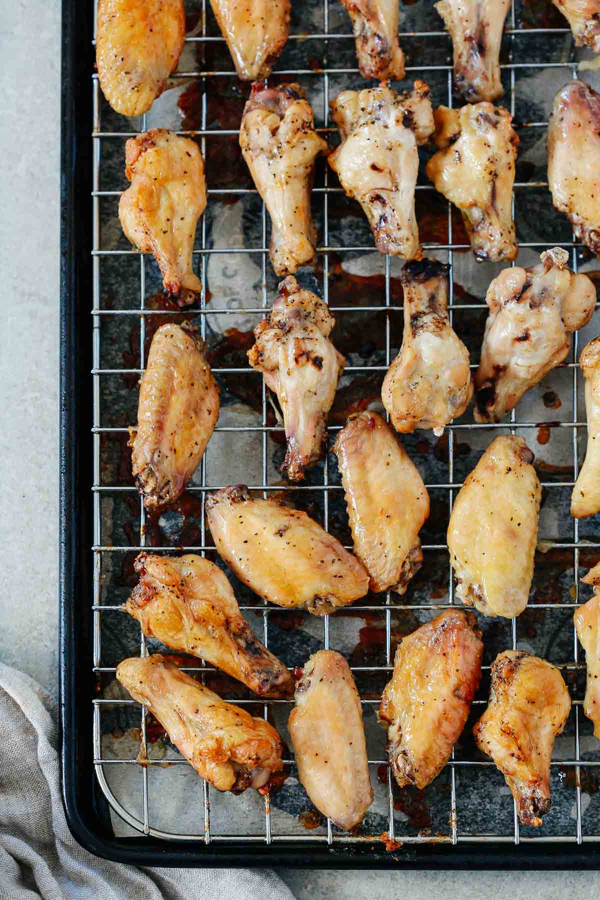 close up of chicken wings on a cooling rack