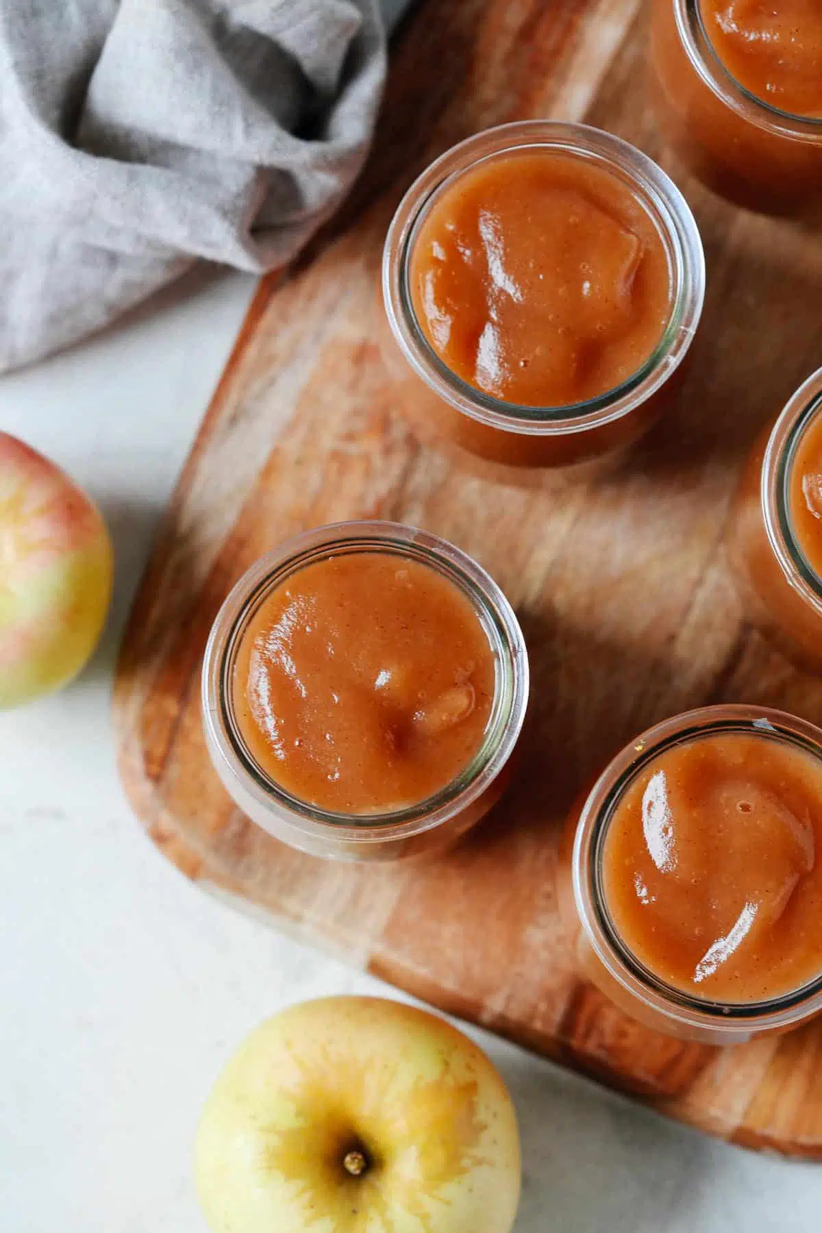 close up of applesauce in a glass jar