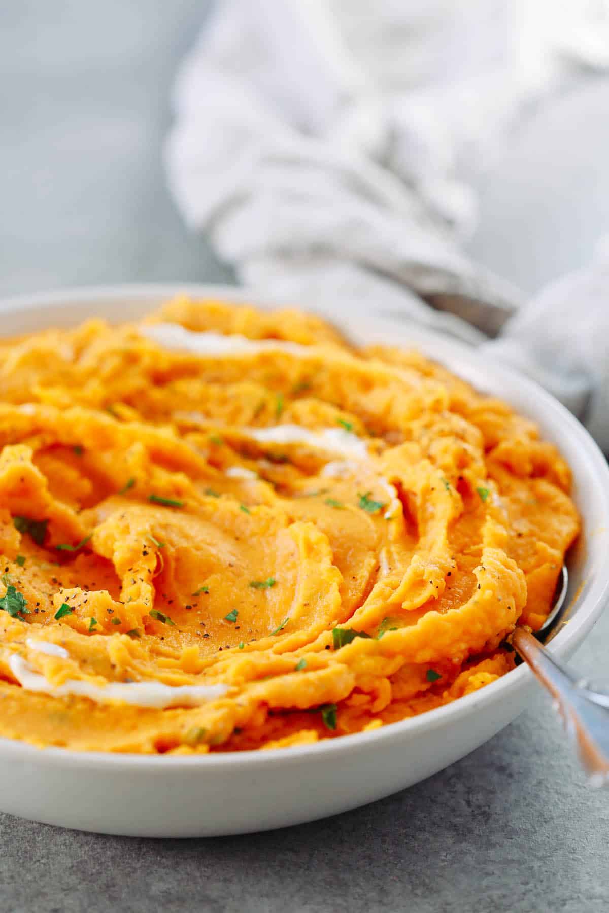 Close up of a bowl of savory mashed sweet potatoes