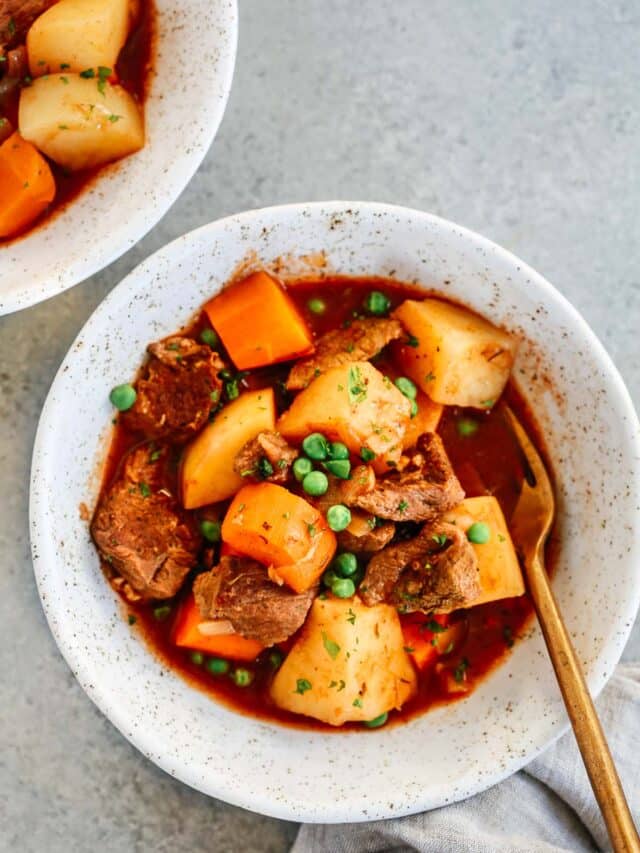 White bowl with healthy slow cooker beef stew inside.