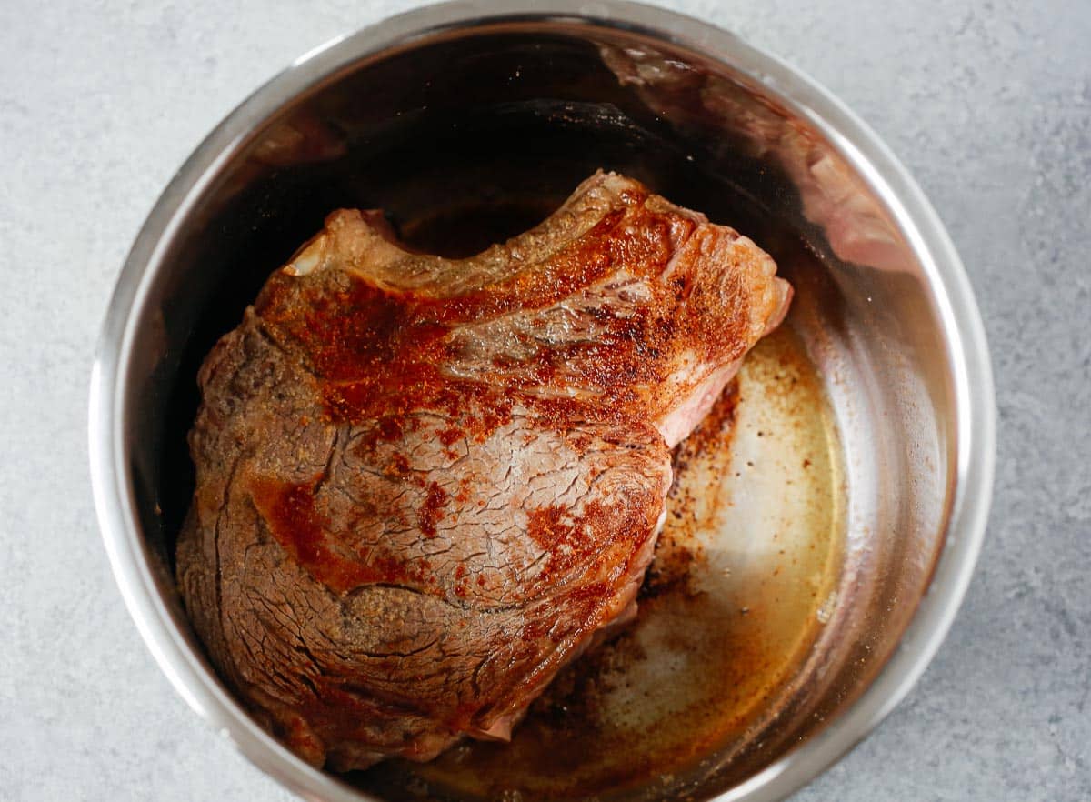Chuck roast seared in a pressure cooker.