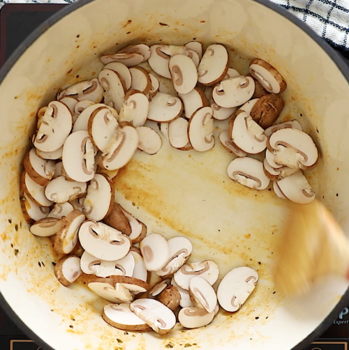 overhead view of a large pot containing mushrooms