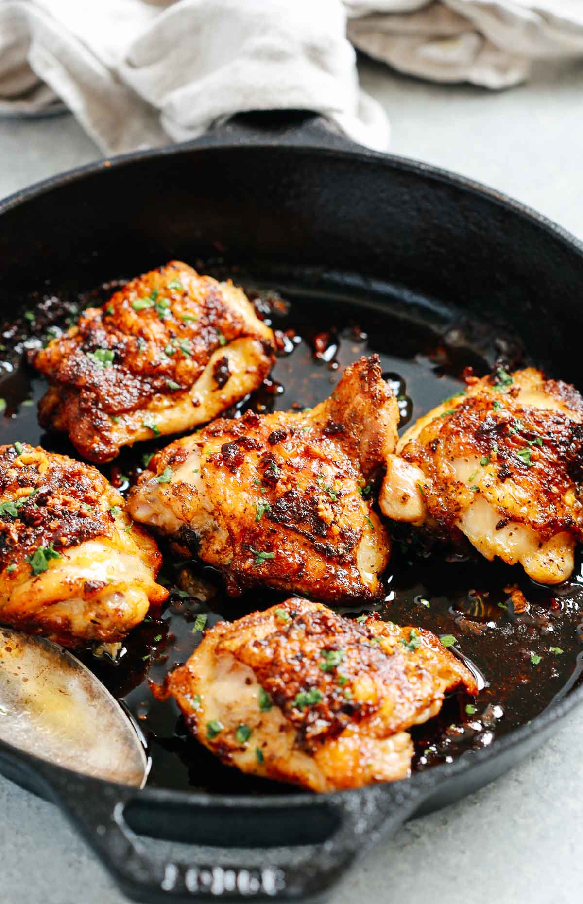 close up of cooked Chicken in a cast iron skillet  