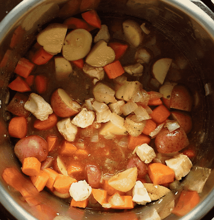 overhead view of a chicken stew inside of an instant pot