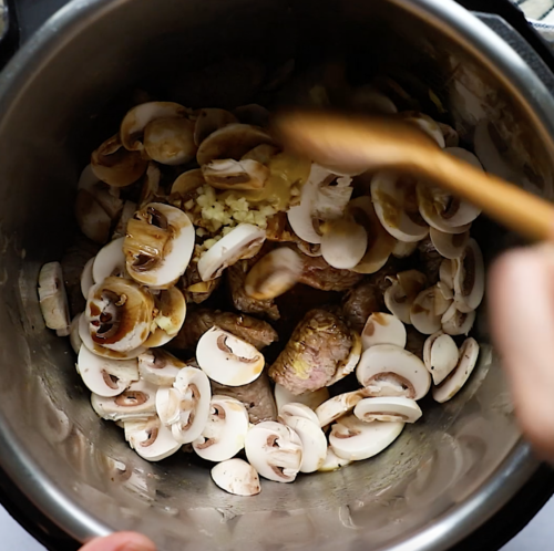 overhead view of an instant pot containing mushroom and sirloin steak