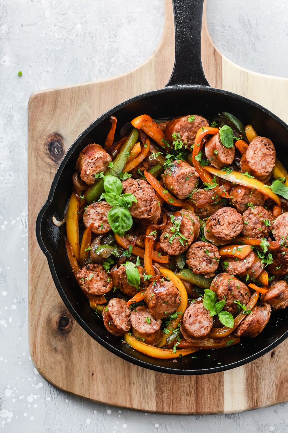 Low-carb Dinner Recipes: overhead view of a cast iron skillet with  sausage and bell pepper.