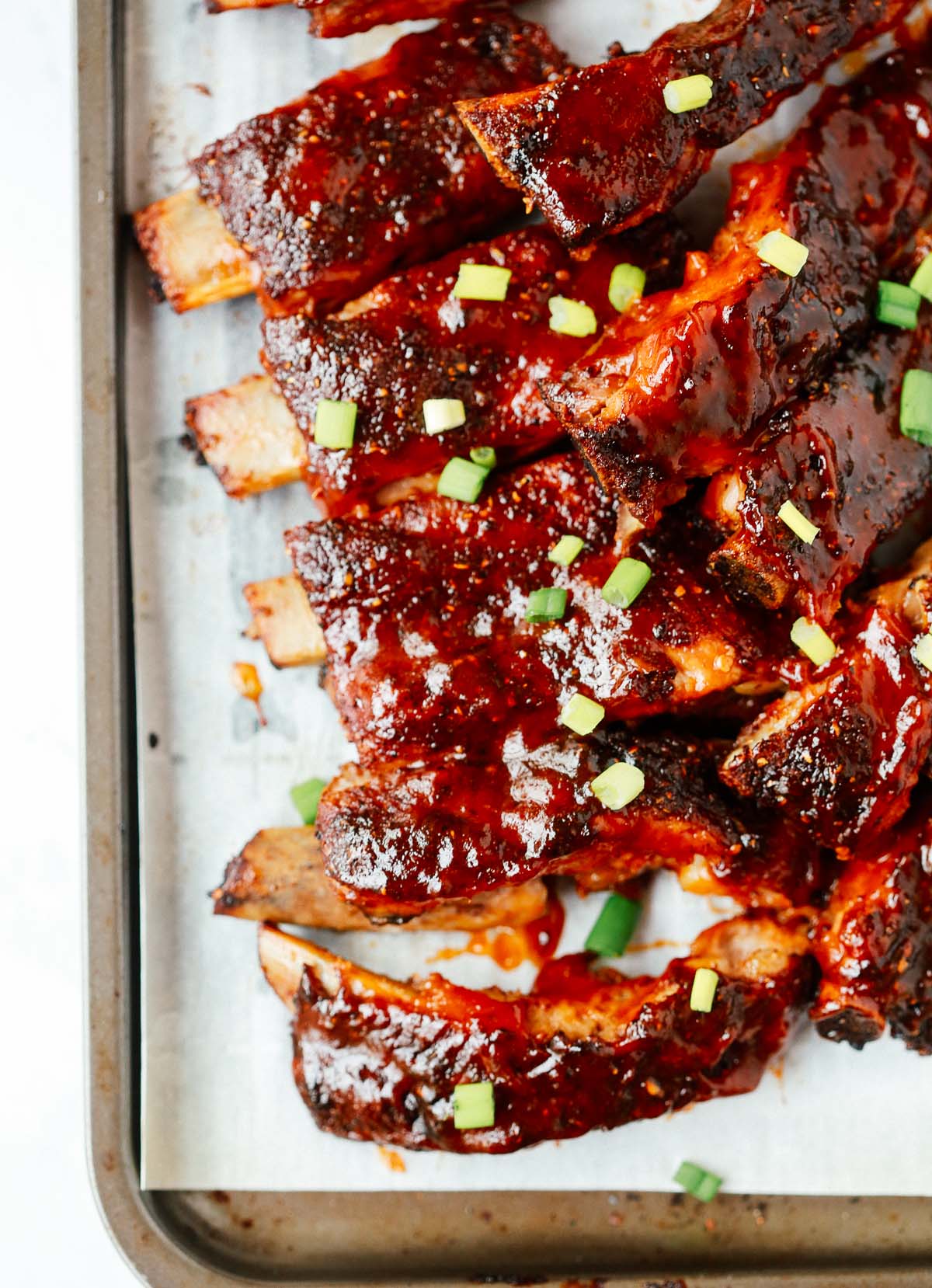 Close up of a rack of cooked slow cooker ribs.