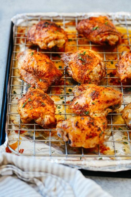 overhead view of chicken thighs on a rack