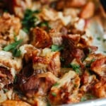 close up of carnitas on a baking sheet