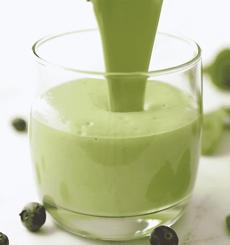 close up of a glass of green smoothie