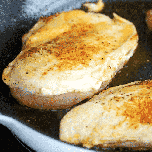 seared chicken breast in a cast iron skillet
