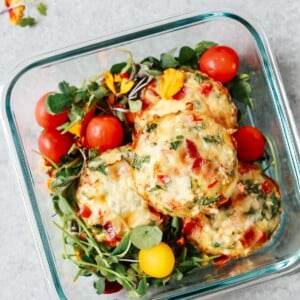 overhead view of muffins inside of a glass food container