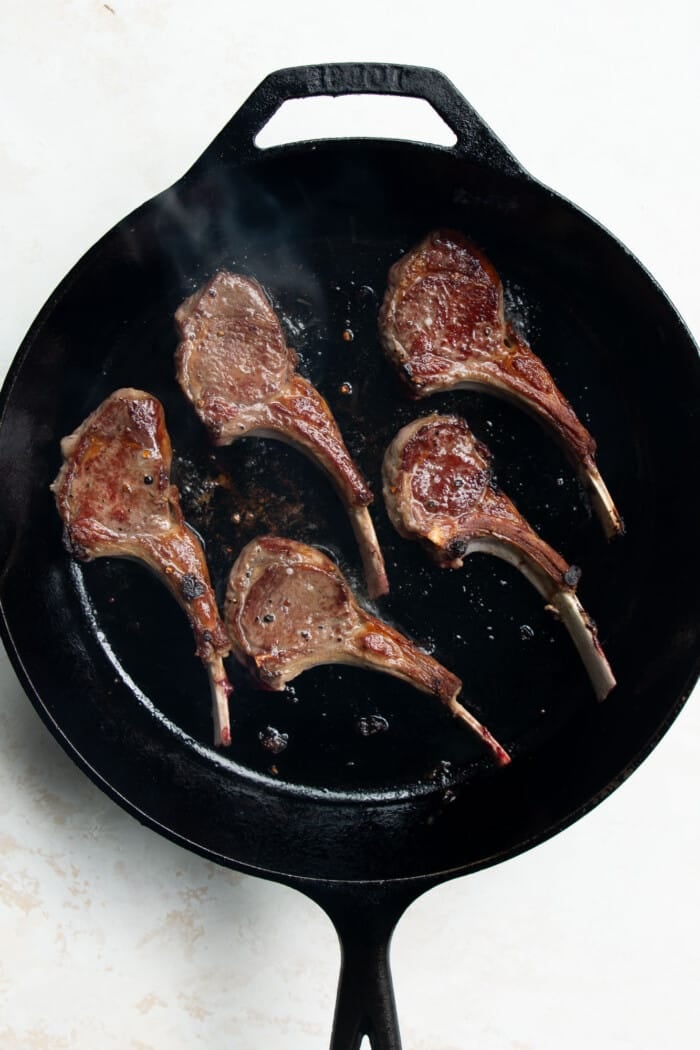 lamb chops in a skillet