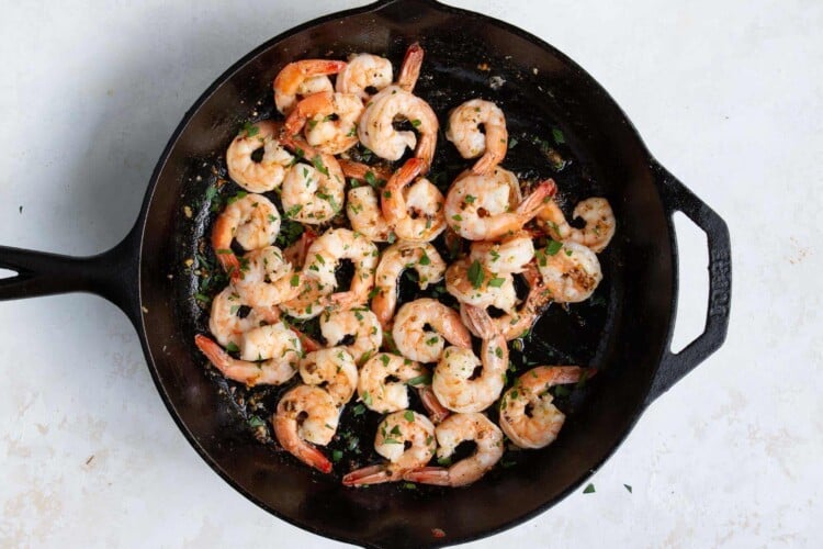 garlic butter shrimp in a cast iron skillet