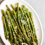 overhead view of air fryer asparagus