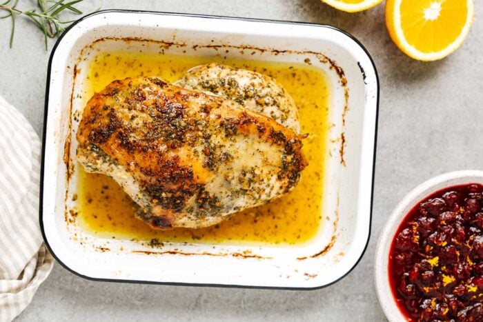 garlic butter turkey breast in a baking sheet.