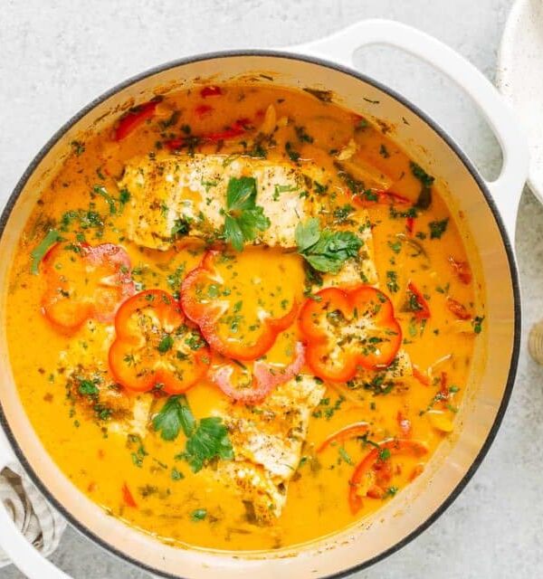 overhead view of fish stew in a white pot
