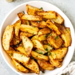 overhead view of air fryer potato wedges