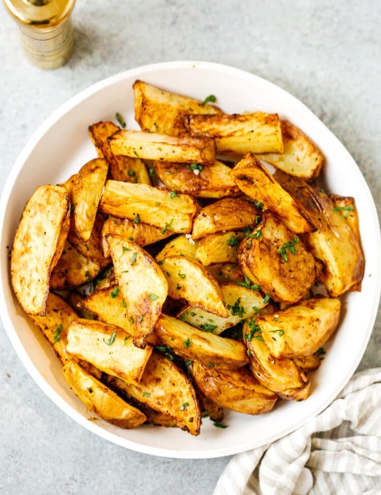 overhead view of air fryer potato wedges