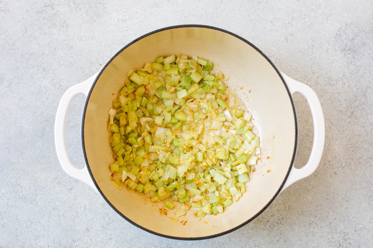 overhead view of a a pot containing sautéed onion