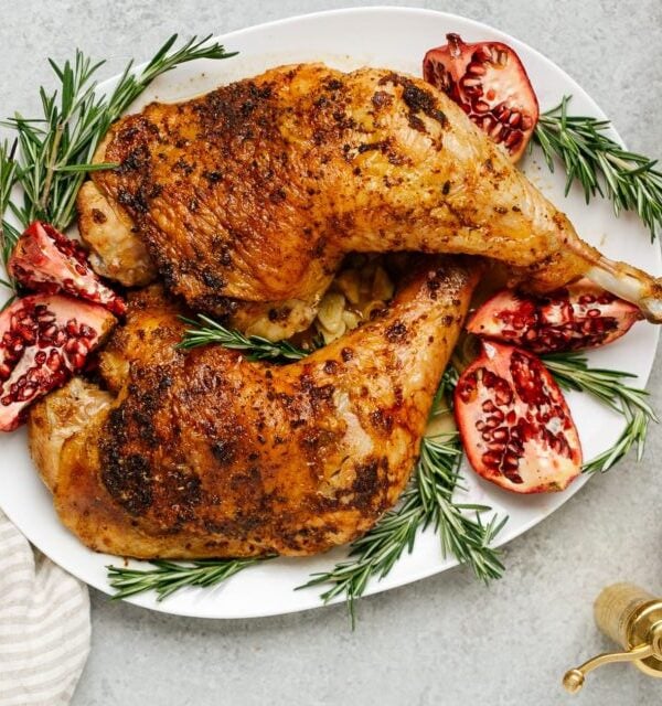 overhead view of roasted turkey leg on a white plate