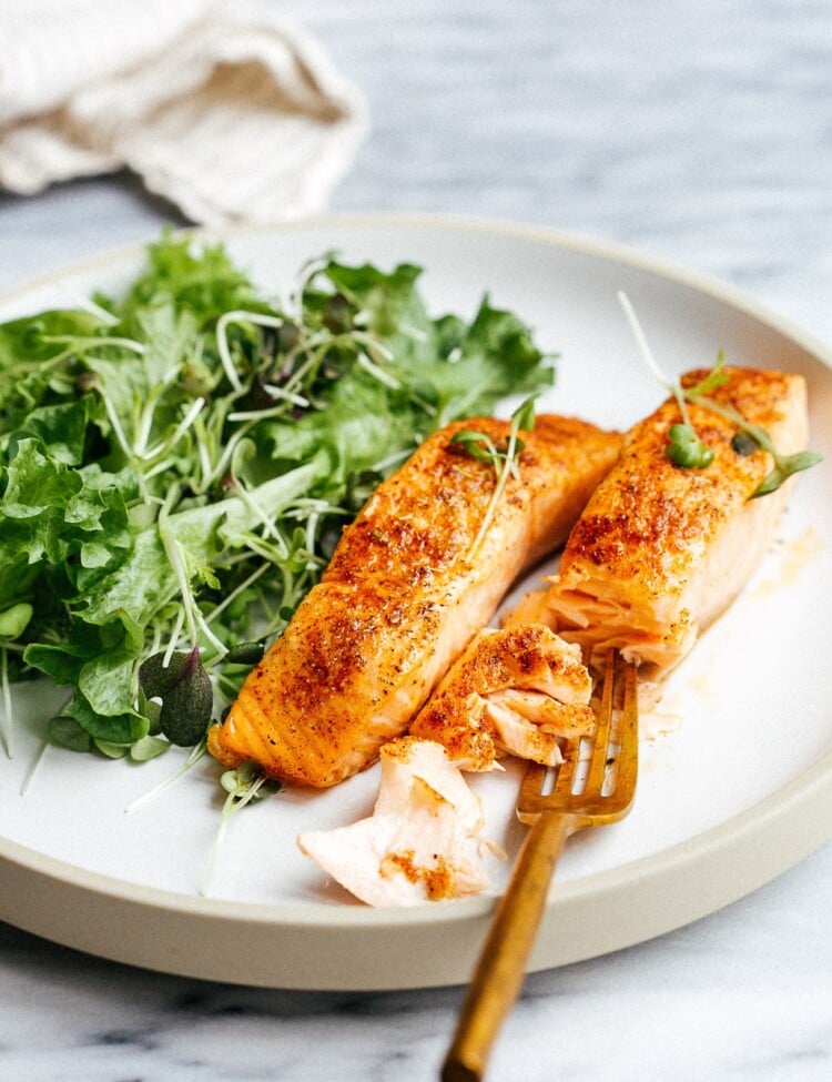 closeup of white plate containing air fryer salmon