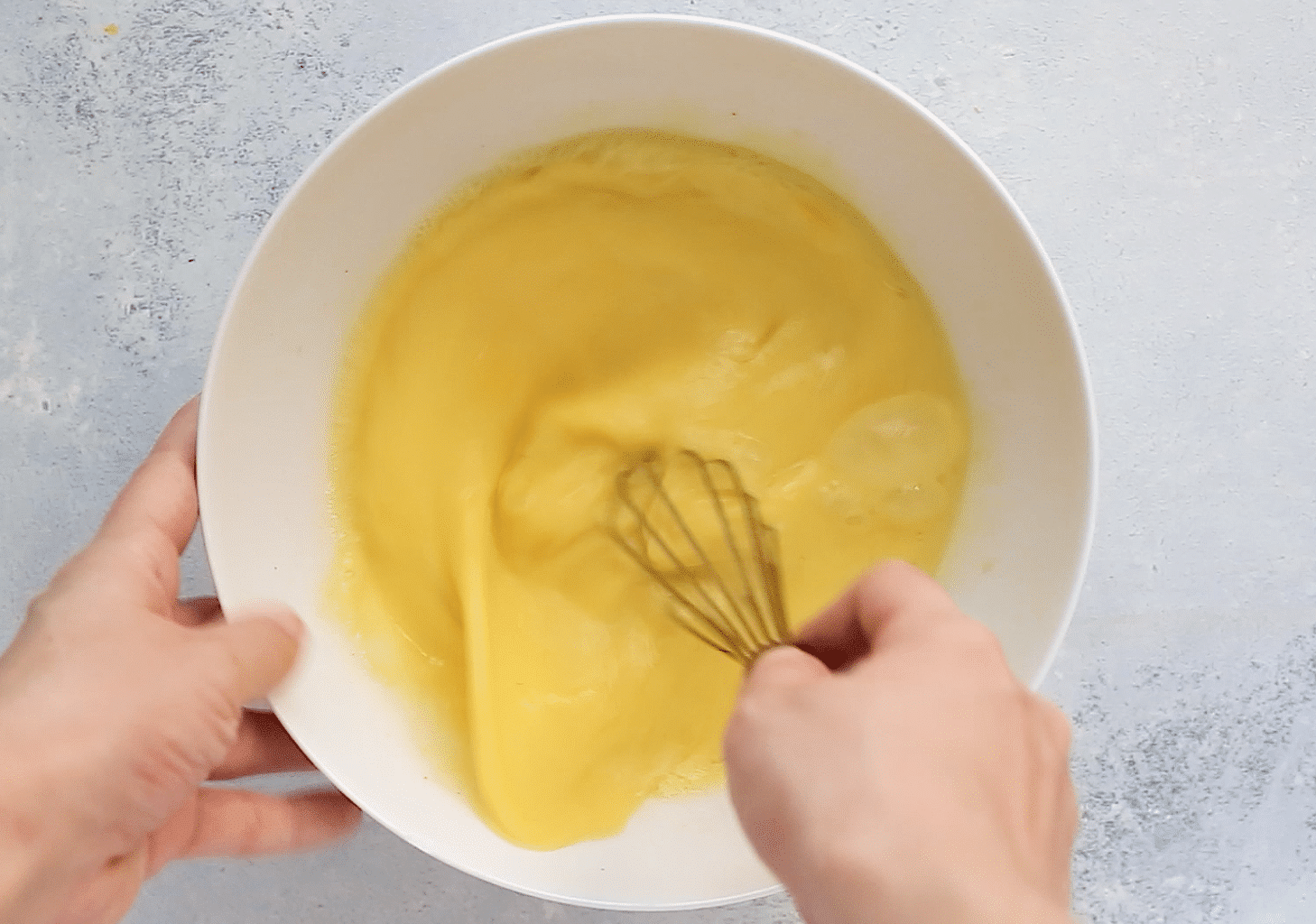 beaten eggs in a white bowl